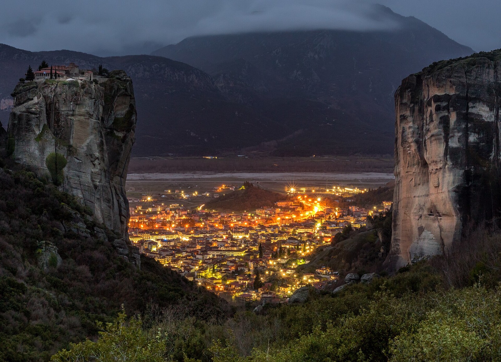 Meteora monasteries lit on the rocks after dark